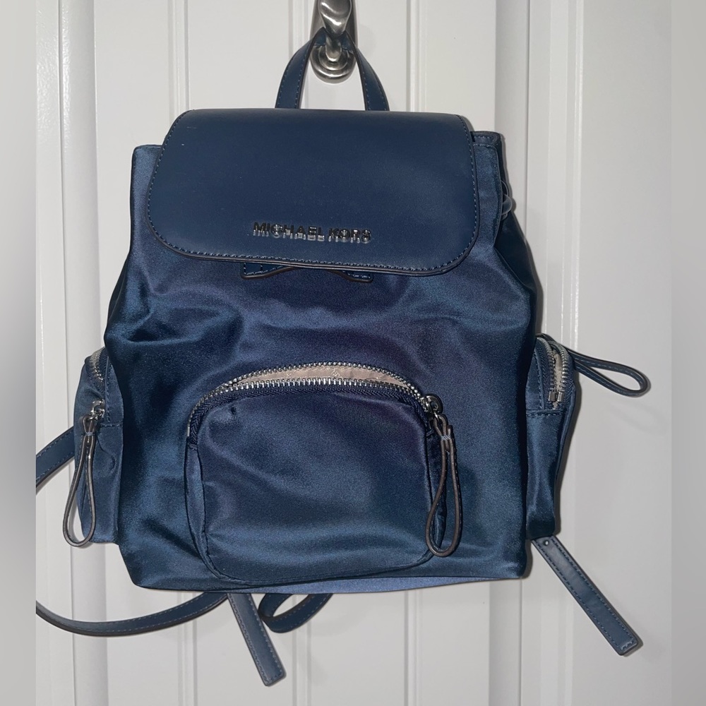 Small blue Michael Kors backpack.